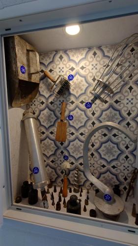 a kitchen counter with a sink and utensils on a wall at alte Bäckerei Bautzen - 04 #Business# im Zentrum, mit Parkplatz, Top Ausgestattet in Bautzen