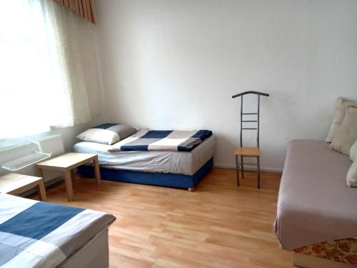 En eller flere senge i et værelse på Apartment Haus Essen