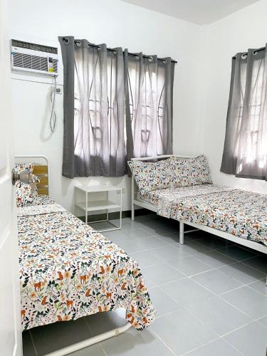 Giường trong phòng chung tại Casas Bugambilias Door 1