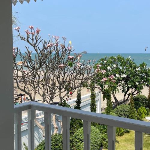 a balcony with a view of the beach at 26Villa Huahin in Khao Tao