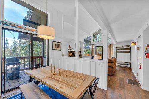 a kitchen and dining room with a wooden table at Bright 3BR Near Kings Beach and Northstar in Tahoe Vista