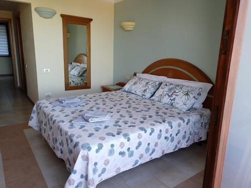 Postel nebo postele na pokoji v ubytování La pecorella in vacanza IUN R3384