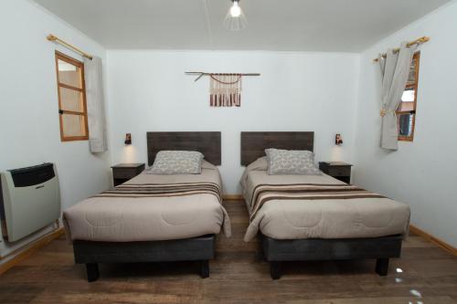Ein Bett oder Betten in einem Zimmer der Unterkunft Casa Lickana B&B