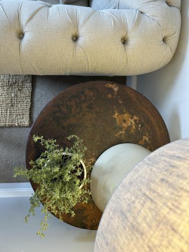 a table with a bowl with a plant on it at Bridport Town Centre Flat in Bridport