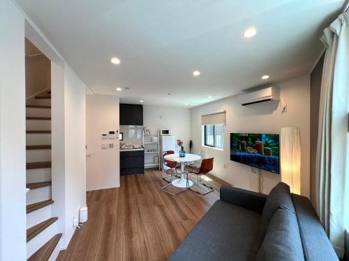 a living room with a couch and a table at Shibuya House-SY0108 in Tokyo