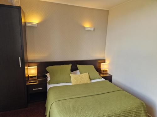 Postel nebo postele na pokoji v ubytování Hotel Bal