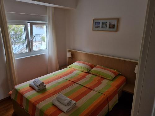 Postel nebo postele na pokoji v ubytování Apartments Bečići Sunset