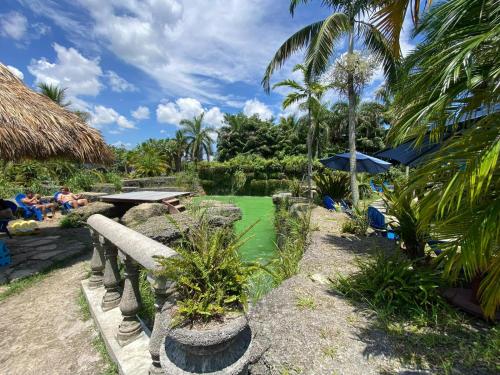 a resort with a pond and palm trees and people at Free BBQ in RV With Private entrance in Homestead