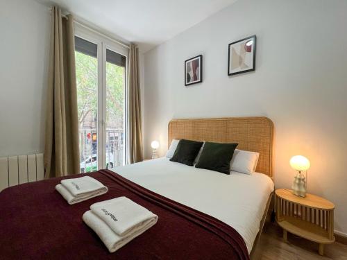 Posteľ alebo postele v izbe v ubytovaní Stay U-nique Apartments Urgell