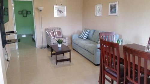 a living room with a couch and two chairs at Charming & Family-Friendly Boqueron Village Condos! in Boqueron