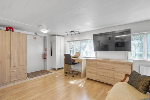 an office with a desk and a computer in a room at Lara Studio in Laugardalur valley, Reykjavík Central Park and Botanical Garden, Private entrance, FREE Private Parking on side in Reykjavík