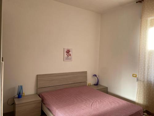 Una cama o camas en una habitación de Villa fronte spiaggia in salento torre mozza