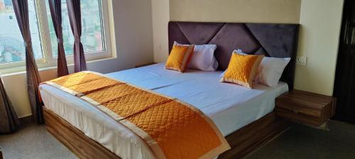 Postel nebo postele na pokoji v ubytování Sugara Homestay