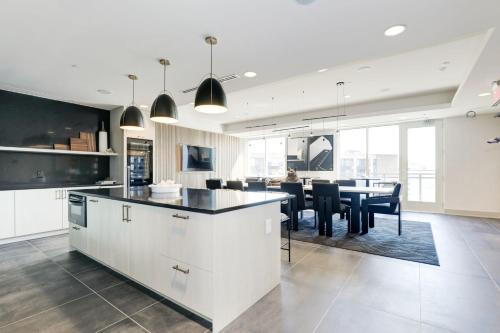 a kitchen and dining room with a table and chairs at Capitol Convenience 2BR Luxury Minutes from DC in Arlington