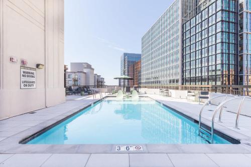 a swimming pool in the middle of a building at Jetsetter's 2BR Hub Between DC & Airport in Arlington