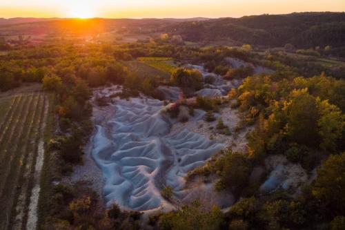an aerial view of a river at sunset at App Damiani in Oprtalj