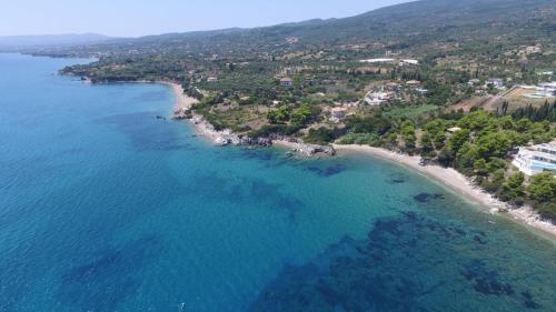 an aerial view of a beach and the ocean at Veneta's House in Nerómilos