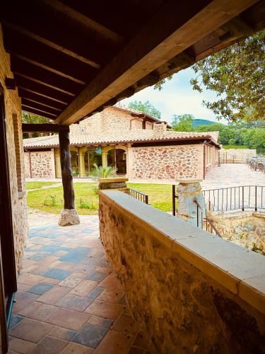 a stone wall in front of a house at La Quinta Luxury Palace in Arnuero
