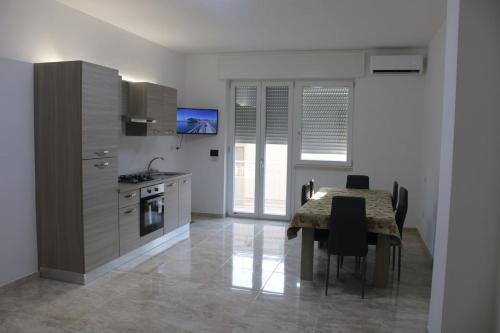 Køkken eller tekøkken på Eva D'Estate Casa Vacanze Salento