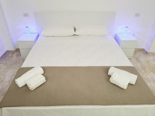 En eller flere senge i et værelse på Eva D'Estate Casa Vacanze Salento