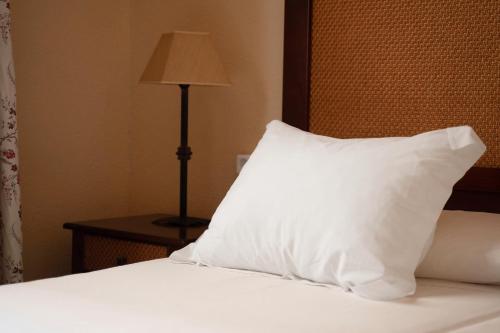 Postel nebo postele na pokoji v ubytování Hotel Albaida Nature