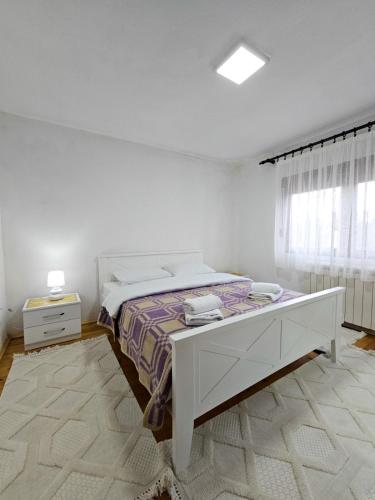 Postel nebo postele na pokoji v ubytování Apartmani KASALICA