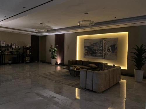 a large living room with a couch and a table at Stylish Studio Urban Retreat in Dubai