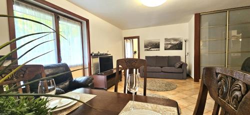 a living room with a table and a couch at VIP Apartamenty Sienkiewicza in Zakopane