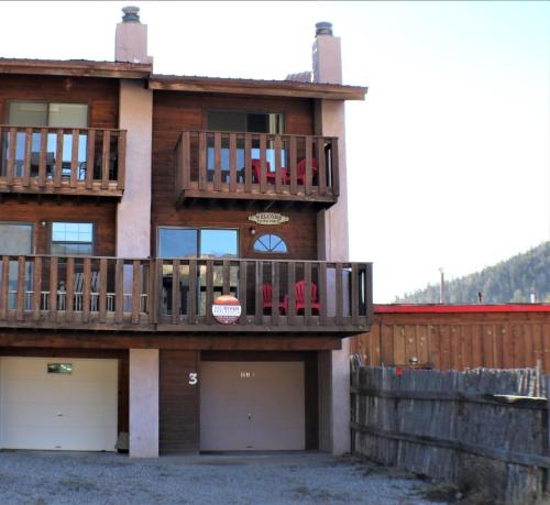 a house with two decks and two garage at Mountain View 3 - Grill - WiFi - Mountain Views - Washer - Dryer - Garage Access - Walk to Everything in Red River