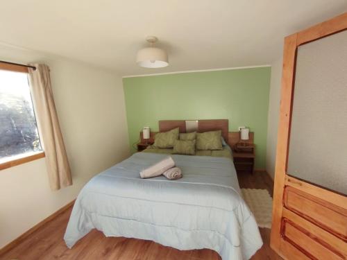 En eller flere senge i et værelse på Casa Giovanna