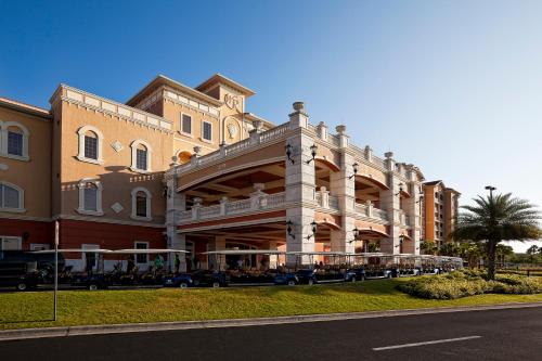 a large building with a restaurant in front of it at Westgate Town Center Resort in Orlando