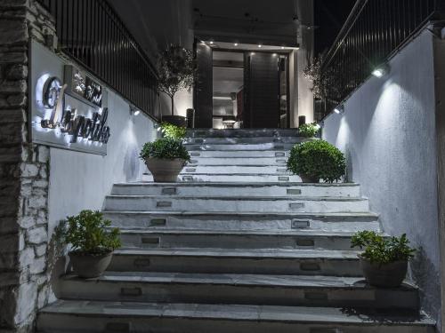 a set of stairs with potted plants on them at Despotiko in Portariá