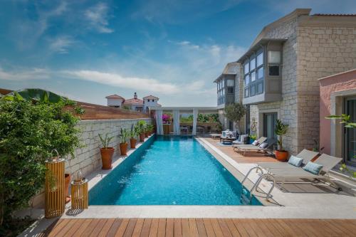 an image of a swimming pool in a house at Muse Alaçatı in Alacati