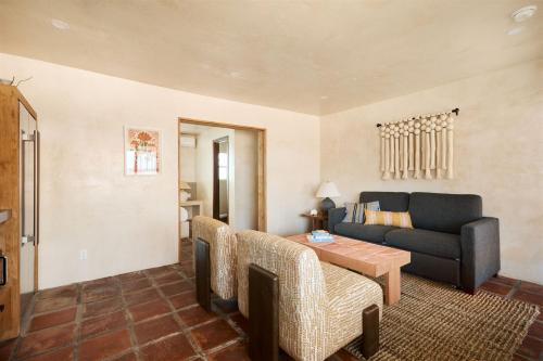 a living room with a couch and a table at Sand Castle in Imperial Beach