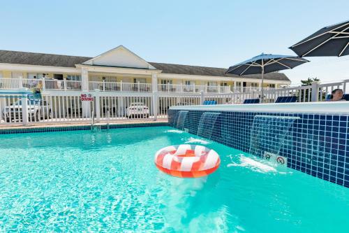 a swimming pool with a lifebuoy in the water at The Beach Club on Madison Avenue in Cape May