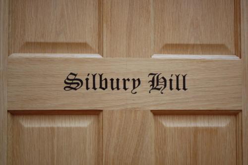 a wooden door with the words slurry jam on it at B&B Dorwyn Manor in Avebury