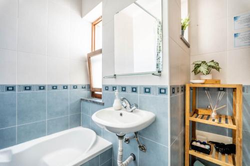 a bathroom with a sink and a bath tub at On the way!* in Portimão