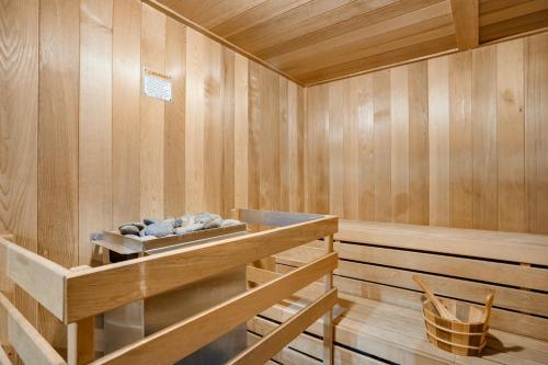 a sauna with wooden walls and wooden floors at 1BR ROOFTOP POOL-10 MIN WALK TO BEACH in Boynton Beach