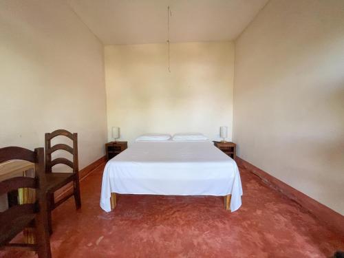 Ein Bett oder Betten in einem Zimmer der Unterkunft Posada La Sabila