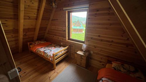 an overhead view of a bedroom in a log cabin at Sweet Home Zabljak in Žabljak