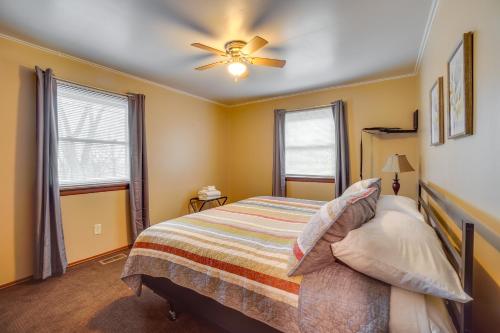 a bedroom with a bed and a ceiling fan at Shell Knob Home with Fire Pit, Near Table Rock Lake! in Shell Knob
