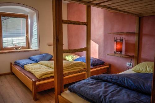 a bedroom with two bunk beds and a mirror at Apartment Kamacir in Kobarid