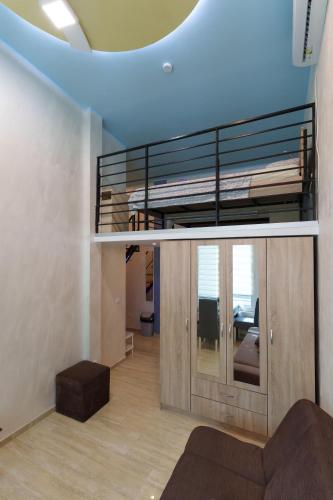 a living room with a bunk bed in a house at Step rooms apt spa in Belgrade