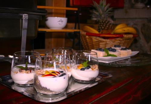 a tray with several glasses of food on a table at Boutique B&B Agroturizam Sv. Juraj in Krk
