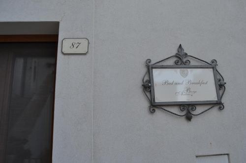 a sign on the side of a building at Al Borgo Antico Ristorante e B&B in Crispiano