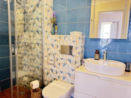 a bathroom with a sink and a toilet at Boho and More in Sozopol