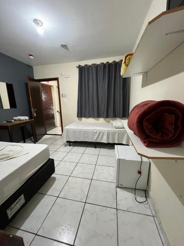 Katil atau katil-katil dalam bilik di Hotel Rodeio