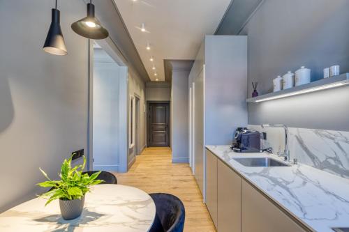 a kitchen with a sink and a counter top at Apartments Vitenberg in Cēsis