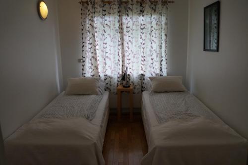 Postel nebo postele na pokoji v ubytování Skógar Apartment