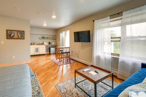 a living room with a couch and a table at Meredith Studio Near Downtown Hike, Swim, Ski! in Meredith